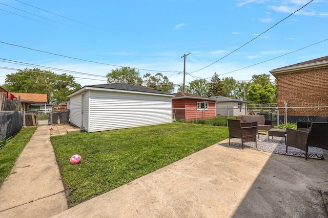 view of yard featuring a patio and an outdoor structure