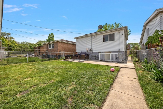 back of property with a patio area and central AC
