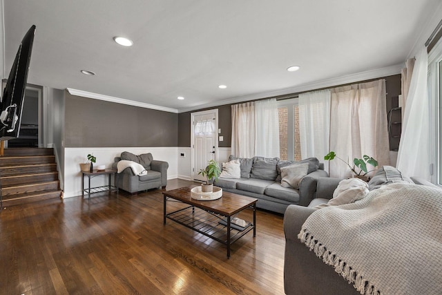 living area featuring crown molding, wainscoting, wood finished floors, recessed lighting, and stairs