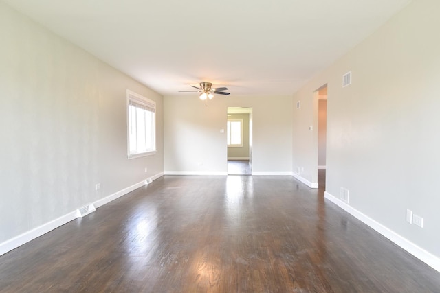 430 Marquette Ave, Calumet City, IL 60409 - spare room with a ceiling fan, dark wood-style floors, and baseboards