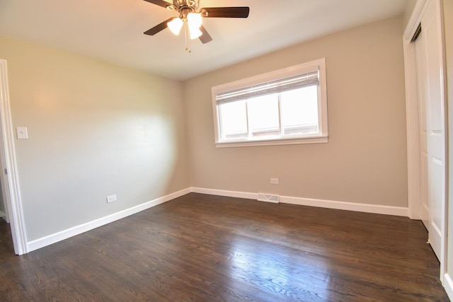 430 Marquette Ave, Calumet City, IL 60409 - unfurnished bedroom featuring a closet, dark wood-style flooring, and baseboards