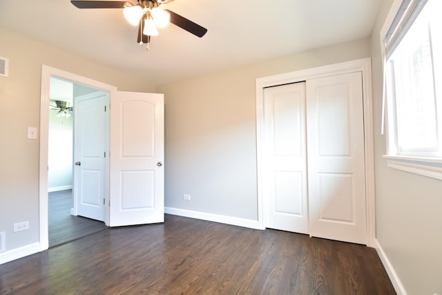 430 Marquette Ave, Calumet City, IL 60409 - unfurnished bedroom with dark wood-style floors, baseboards, a closet, and ceiling fan
