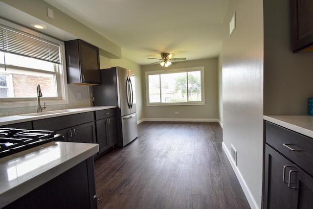430 Marquette Ave, Calumet City, IL 60409 - kitchen with a sink, light countertops, dark wood finished floors, and a ceiling fan