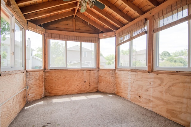 unfurnished sunroom with healthy amount of natural light and a ceiling fan