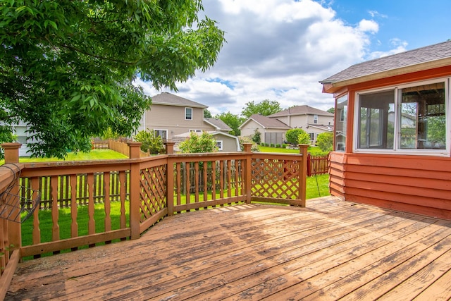 wooden deck featuring a residential view
