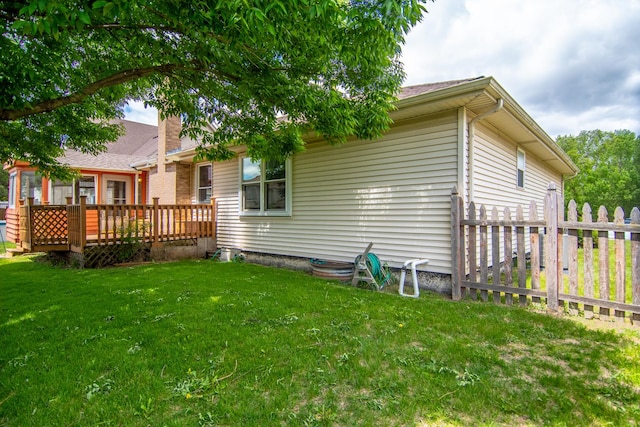 back of property with a deck