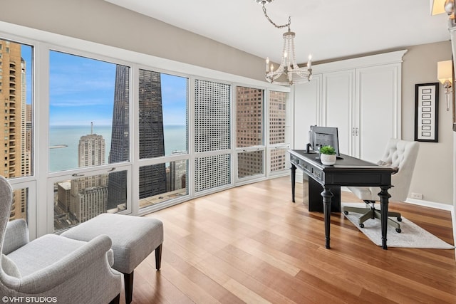 100 E Huron St Unit 4801, Chicago, IL 60611 - office with a chandelier, light wood finished floors, a water view, and healthy amount of natural light