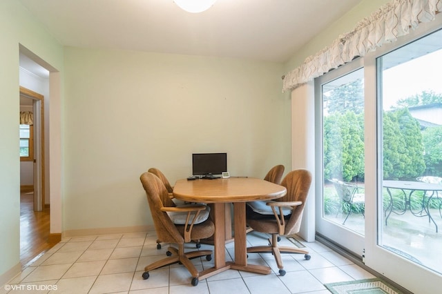 91 Fletcher Dr, Des Plaines, IL 60016 - dining area featuring plenty of natural light, baseboards, and light tile patterned flooring