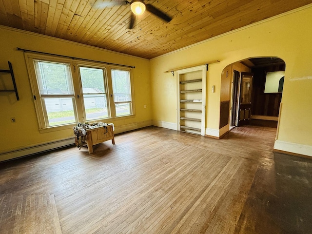 204 N Center St, Colfax, IL 61728 - empty room with arched walkways, ceiling fan, wooden ceiling, baseboards, and wood finished floors