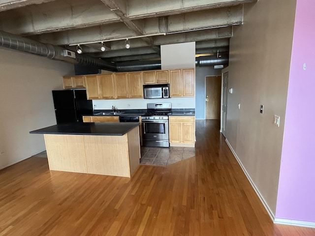 5200 S Ellis Ave Unit 202N, Chicago, IL 60615 - kitchen with black appliances, a sink, dark wood-type flooring, dark countertops, and light brown cabinetry