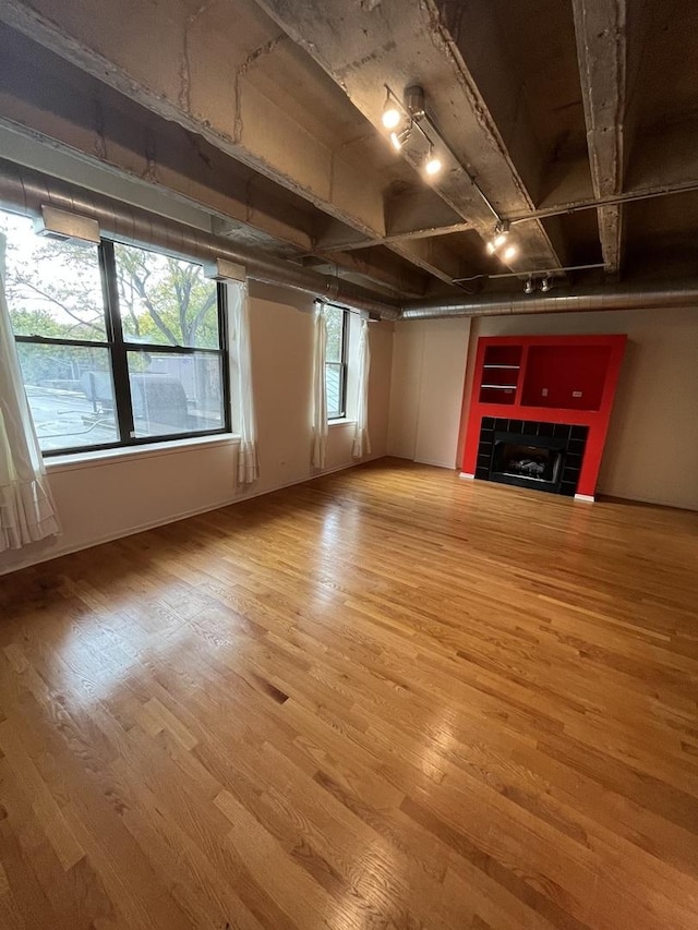 5200 S Ellis Ave Unit 202N, Chicago, IL 60615 - unfurnished living room featuring light wood-style flooring and a tile fireplace