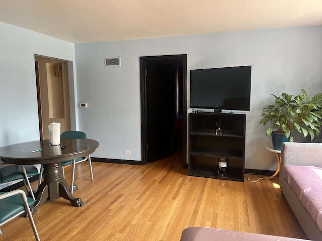 2256 S 15th Ave, North Riverside, IL 60546 - living room featuring light wood-style flooring and baseboards