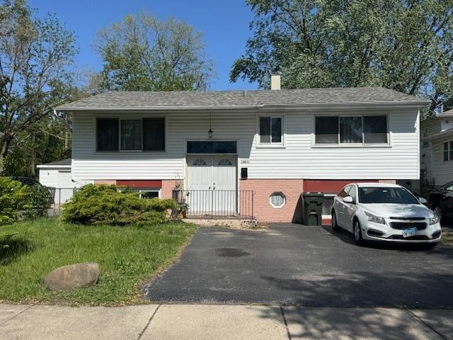 16611 Marshfield Ave, Markham, IL 60428 - raised ranch featuring brick siding and a chimney