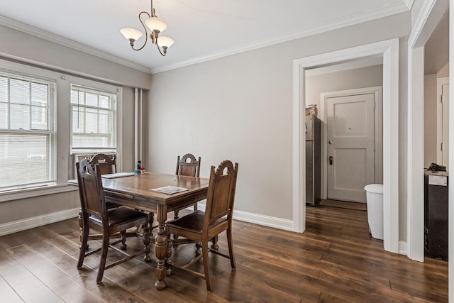 408 N Prairie St Unit 3, Champaign, IL 61820 - dining room with a chandelier, dark wood-type flooring, baseboards, and crown molding