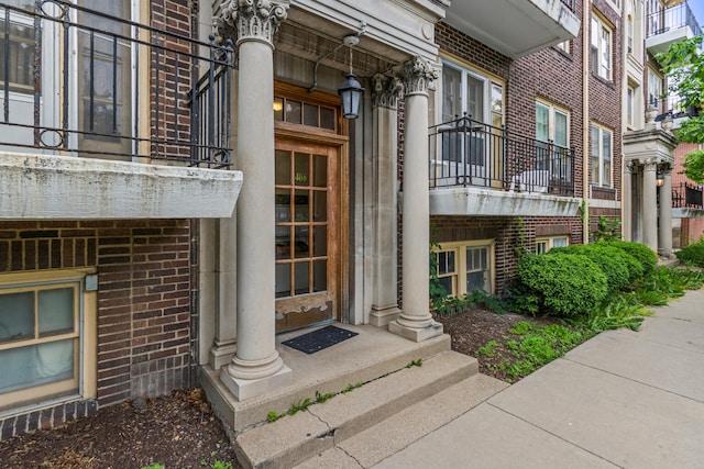 408 N Prairie St Unit 3, Champaign, IL 61820 - property entrance featuring a balcony and brick siding