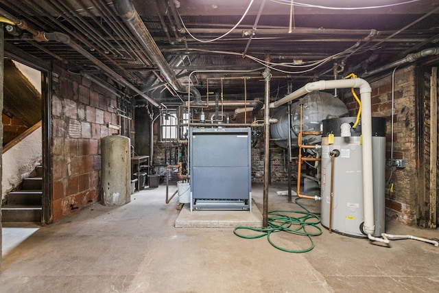 408 N Prairie St Unit 3, Champaign, IL 61820 - unfinished basement featuring gas water heater and stairs