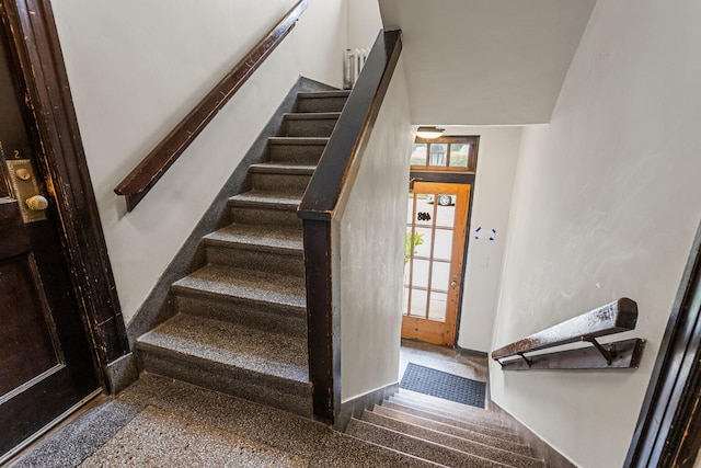408 N Prairie St Unit 3, Champaign, IL 61820 - staircase with speckle patterned floor and baseboards