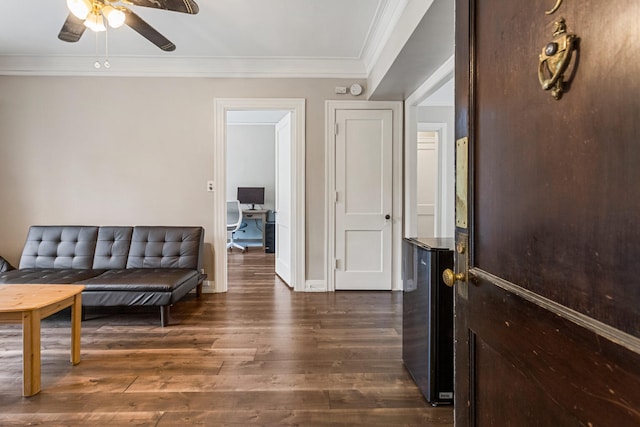 408 N Prairie St Unit 3, Champaign, IL 61820 - sitting room featuring crown molding, dark wood-type flooring, ceiling fan, and baseboards