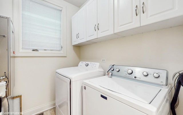 1416 S Emerald Ave, Chicago, IL 60607 - washroom featuring cabinet space, washing machine and dryer, and baseboards