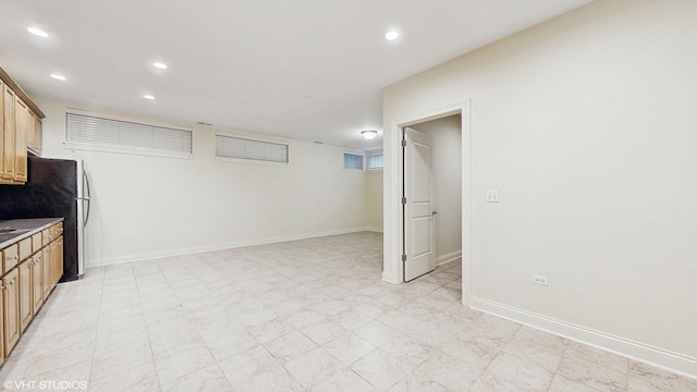 1416 S Emerald Ave, Chicago, IL 60607 - finished below grade area featuring freestanding refrigerator, recessed lighting, and baseboards