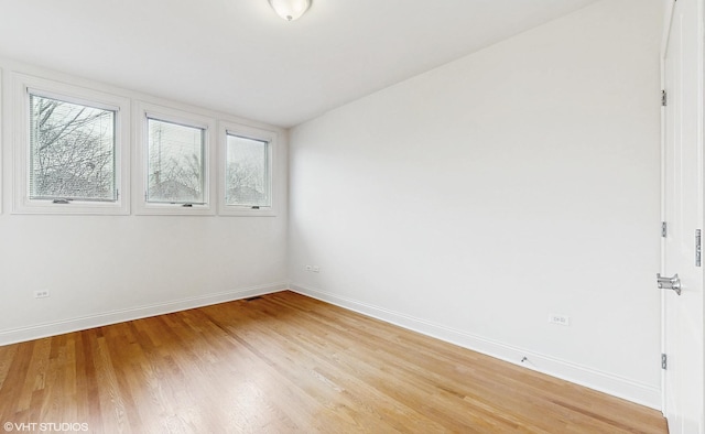 1416 S Emerald Ave, Chicago, IL 60607 - unfurnished room featuring light wood finished floors and baseboards