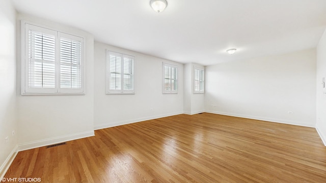 1416 S Emerald Ave, Chicago, IL 60607 - empty room featuring light wood-style flooring and baseboards