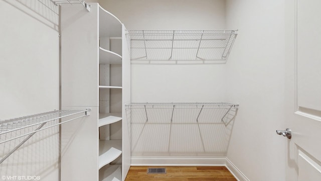 1416 S Emerald Ave, Chicago, IL 60607 - spacious closet with wood finished floors