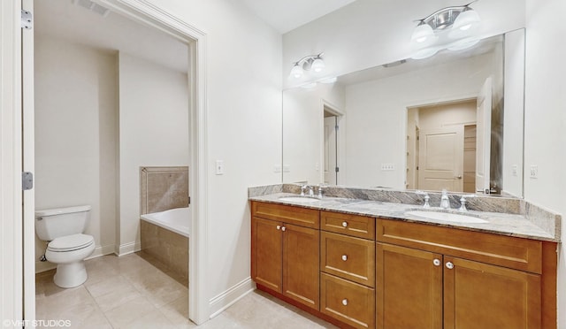 1416 S Emerald Ave, Chicago, IL 60607 - bathroom with toilet, double vanity, tile patterned flooring, a garden tub, and baseboards