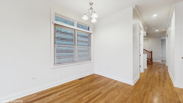 1416 S Emerald Ave, Chicago, IL 60607 - spare room featuring baseboards, light wood-style flooring, a chandelier, and recessed lighting