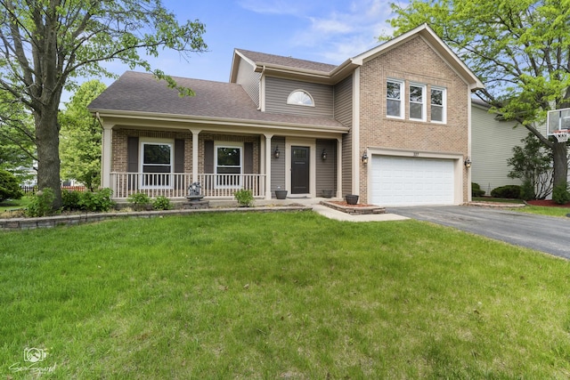 337 Aristocrat Dr, Bolingbrook, IL 60490 - traditional home with a garage, covered porch, driveway, a front yard, and brick siding