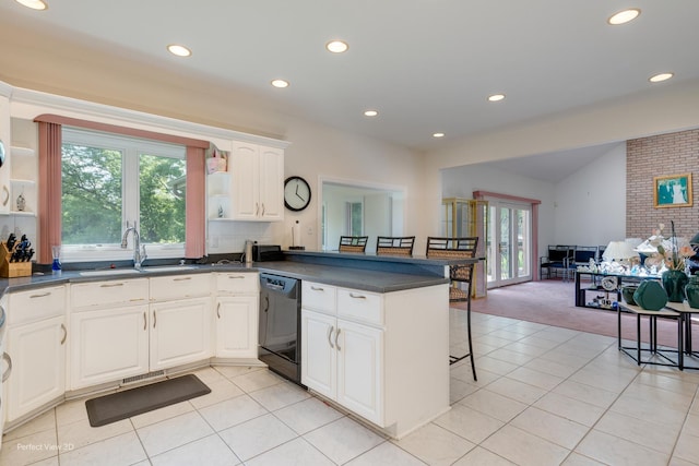 20825 Brookside Blvd, Olympia Fields, IL 60461 - kitchen featuring dishwasher, a sink, dark countertops, a peninsula, and a kitchen bar