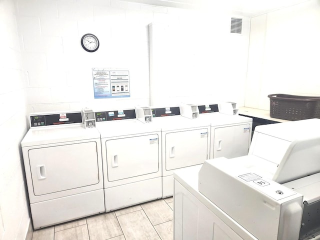 1001 N Mill St Unit 310, Naperville, IL 60563 - communal laundry room featuring washing machine and dryer