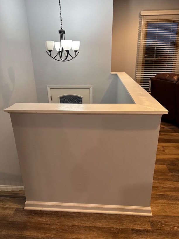 1020 Woodside Dr, Roselle, IL 60172 - bar with a chandelier, dark wood-style flooring, and pendant lighting
