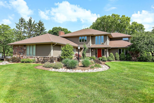 1224 Barclay Cir, Inverness, IL 60010 - view of front of property with a front yard, stone siding, a chimney, and a shingled roof