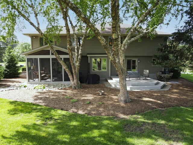1224 Barclay Cir, Inverness, IL 60010 - back of property featuring a sunroom, a patio, and a lawn