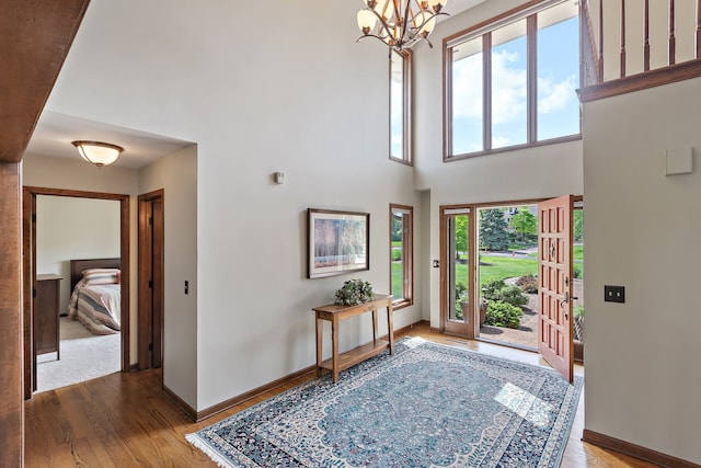 1224 Barclay Cir, Inverness, IL 60010 - foyer entrance with wood finished floors, a chandelier, and baseboards