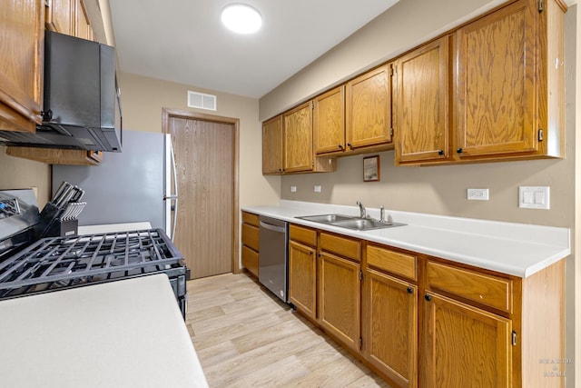 127 Village Creek Dr Unit 0, Lake In The Hills, IL 60156 - kitchen with a sink, stainless steel dishwasher, light wood-style flooring, light countertops, and brown cabinetry