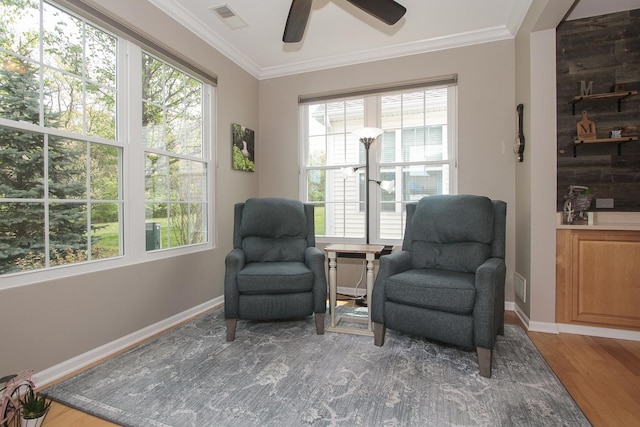 12370 Russet Ln, Huntley, IL 60142 - living area with ornamental molding, wood finished floors, a ceiling fan, healthy amount of natural light, and baseboards
