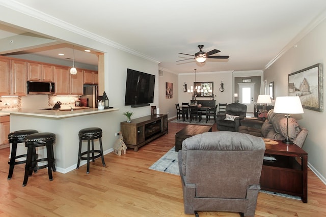 12370 Russet Ln, Huntley, IL 60142 - living room with light wood-style floors, ceiling fan, crown molding, baseboards, and recessed lighting