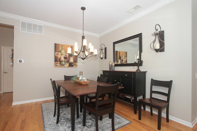 12370 Russet Ln, Huntley, IL 60142 - dining space featuring a chandelier, crown molding, light wood-style flooring, and baseboards