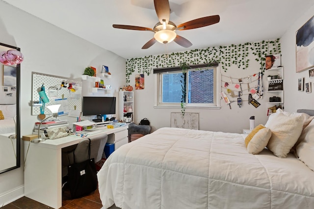 1640 W Sherwin Ave Unit 4D, Chicago, IL 60626 - bedroom with ceiling fan, a desk, and dark tile patterned flooring