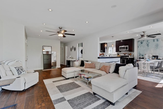 1640 W Sherwin Ave Unit 4D, Chicago, IL 60626 - living area with stacked washing machine and dryer, ceiling fan, dark wood finished floors, and recessed lighting