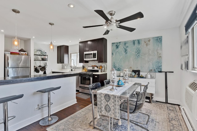 1640 W Sherwin Ave Unit 4D, Chicago, IL 60626 - dining space featuring recessed lighting, a ceiling fan, wood finished floors, and a baseboard heating unit