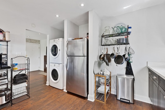 1640 W Sherwin Ave Unit 4D, Chicago, IL 60626 - laundry area with stacked washing machine and dryer, dark wood finished floors, recessed lighting, and baseboards