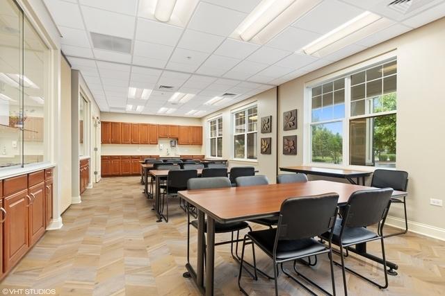 2663 Avondale Cir, Naperville, IL 60564 - dining area featuring baseboards and a paneled ceiling