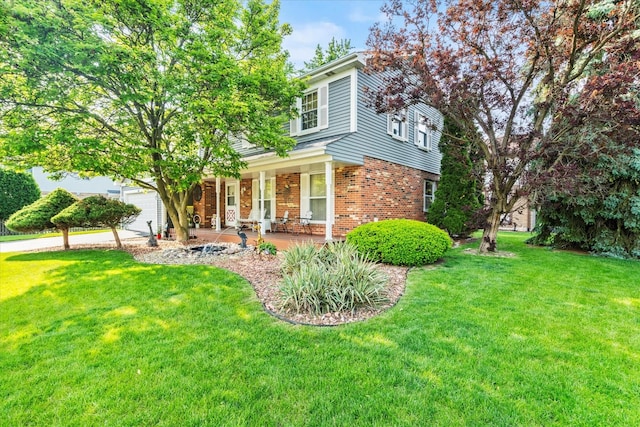 620 W 58th St, Westmont, IL 60559 - view of front of property with covered porch, a front yard, brick siding, and a garage