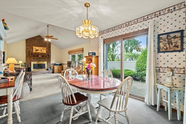 620 W 58th St, Westmont, IL 60559 - dining room with carpet flooring, a chandelier, ceiling fan, vaulted ceiling, and a fireplace