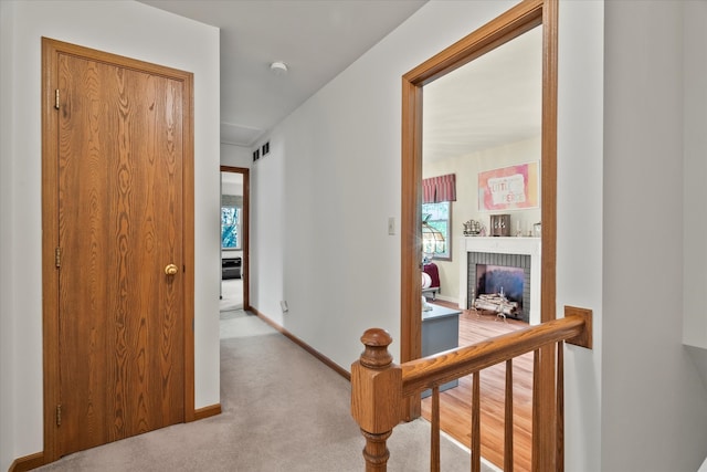 620 W 58th St, Westmont, IL 60559 - corridor with carpet flooring, baseboards, and plenty of natural light