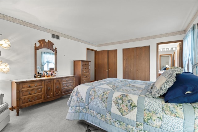 620 W 58th St, Westmont, IL 60559 - bedroom with light carpet and multiple closets