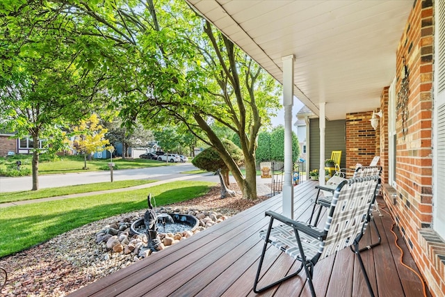620 W 58th St, Westmont, IL 60559 - wooden porch featuring a yard